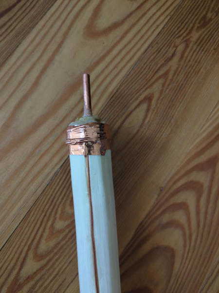 Copper ground spike on the staff tip