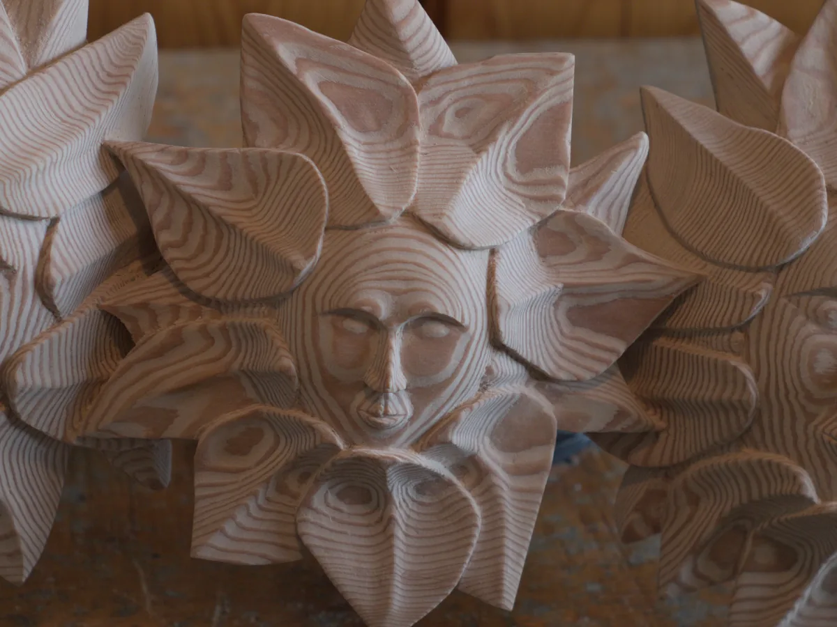Spirit family carving - child face